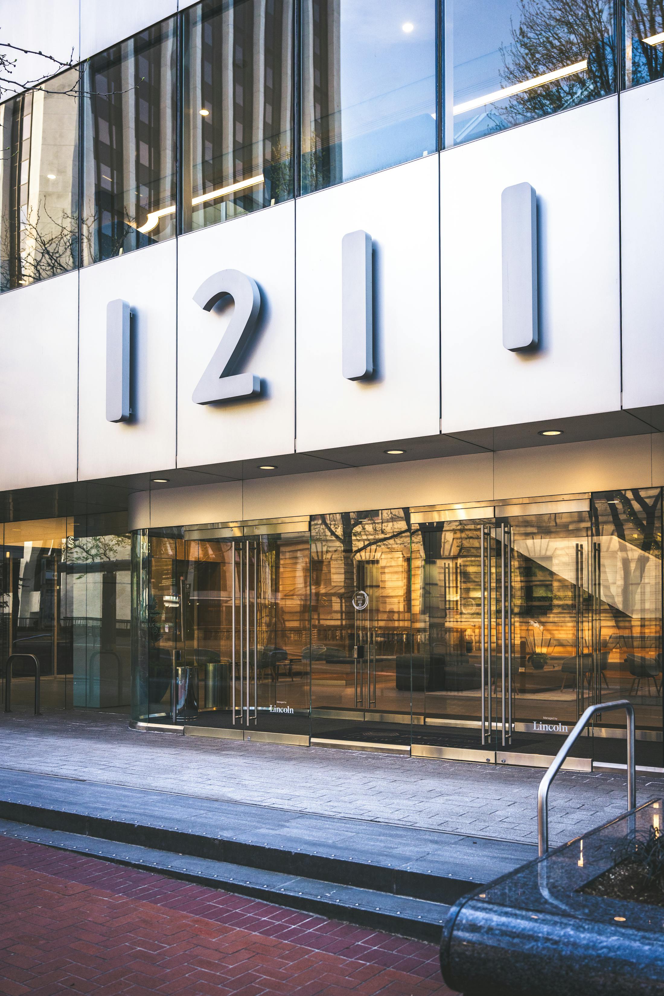Modern commercial office building entrance with glass doors